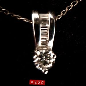 White gold and diamond pendant.